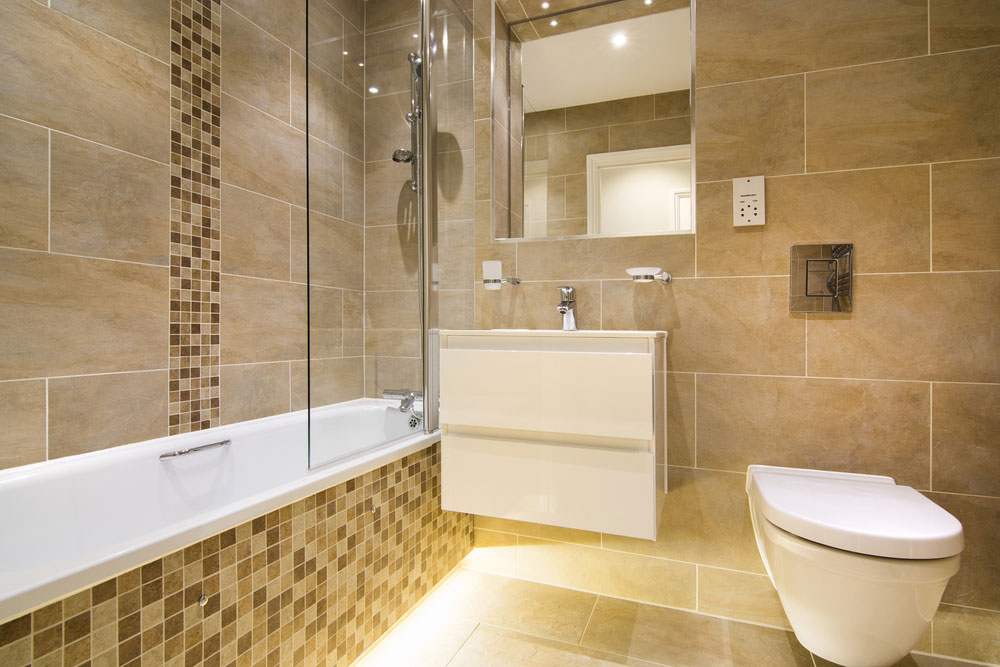 Luxury three piece bathroom in beige - brown with mosaic and natural stone tiles