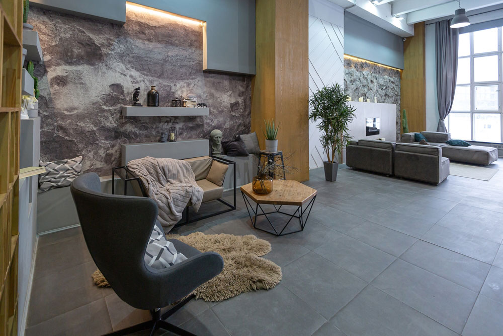 Modern studio interior with decorative stone walls in grey. stone wood, tiles and led lighting